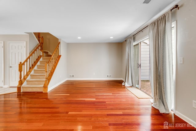 362 Aldeburgh Ave, Franklin Twsp, NJ 08873 - unfurnished room with light wood-type flooring, stairway, baseboards, and recessed lighting