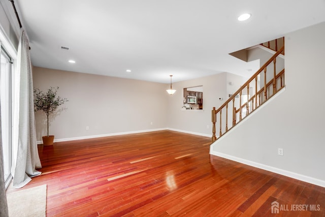 362 Aldeburgh Ave, Franklin Twsp, NJ 08873 - unfurnished living room with stairway, baseboards, wood finished floors, recessed lighting, and plenty of natural light