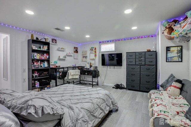 bedroom featuring light wood-type flooring