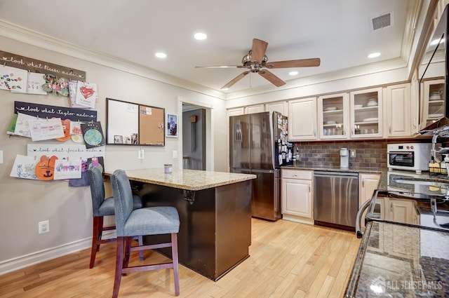 522 Hancock St, Middlesex, NJ 08846 - kitchen with stainless steel dishwasher, freestanding refrigerator, crown molding, light wood-style floors, and light stone countertops
