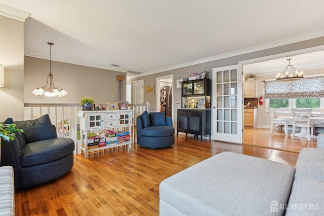 522 Hancock St, Middlesex, NJ 08846 - living room featuring a chandelier, light wood-style flooring, and crown molding