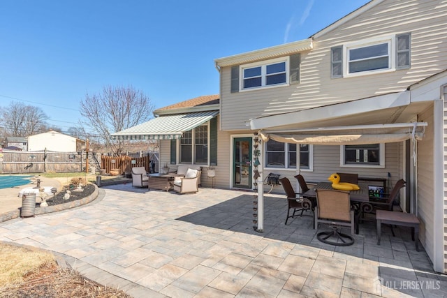 view of patio / terrace featuring outdoor dining space, an outdoor living space, and fence