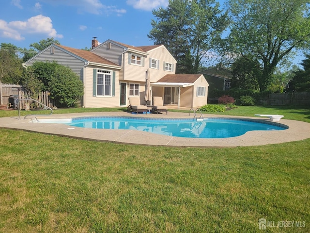 view of swimming pool featuring a fenced in pool, a patio area, fence, and a lawn