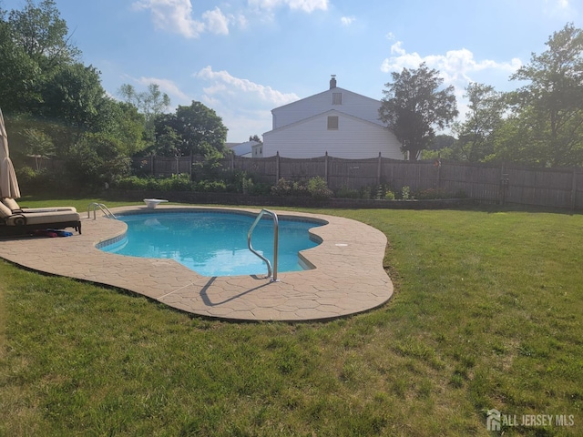 view of pool with a fenced in pool, a patio area, a fenced backyard, and a lawn