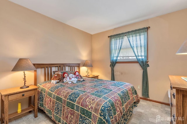 carpeted bedroom with baseboards