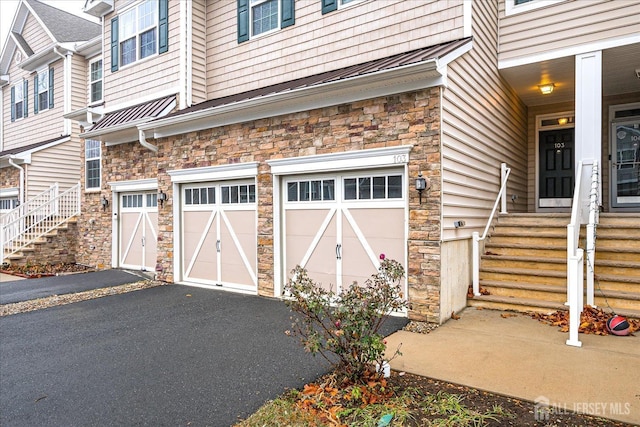 garage featuring aphalt driveway