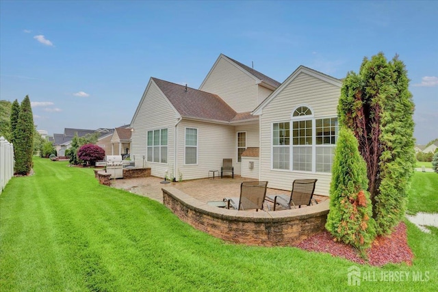 56 Kings Mill Rd, Monroe, NJ 08831 - back of property with a patio and a lawn
