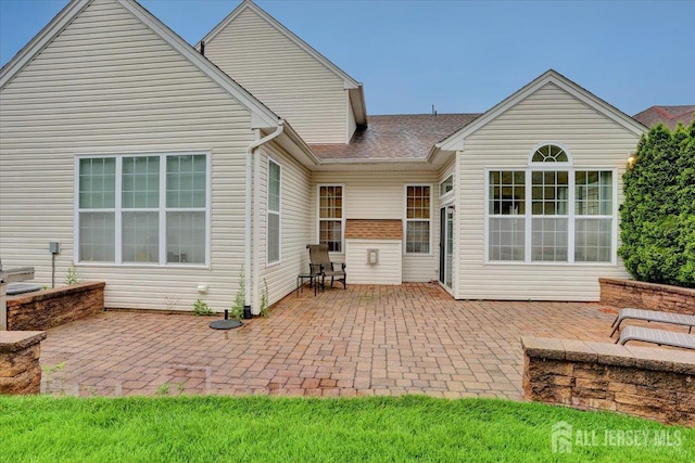 56 Kings Mill Rd, Monroe, NJ 08831 - rear view of house featuring a patio and a shingled roof