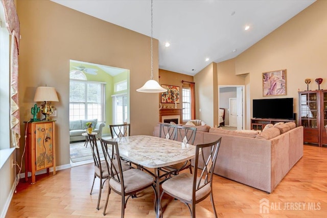 56 Kings Mill Rd, Monroe, NJ 08831 - dining area featuring high vaulted ceiling, a fireplace, light wood-style flooring, a ceiling fan, and recessed lighting