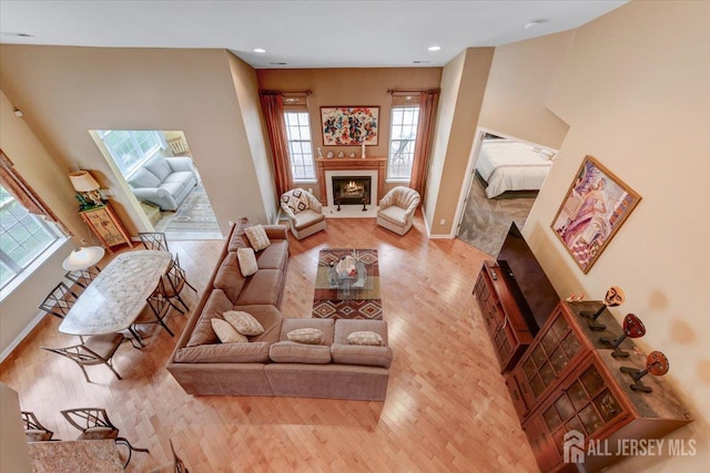56 Kings Mill Rd, Monroe, NJ 08831 - living room featuring wood finished floors, baseboards, a fireplace with flush hearth, and recessed lighting