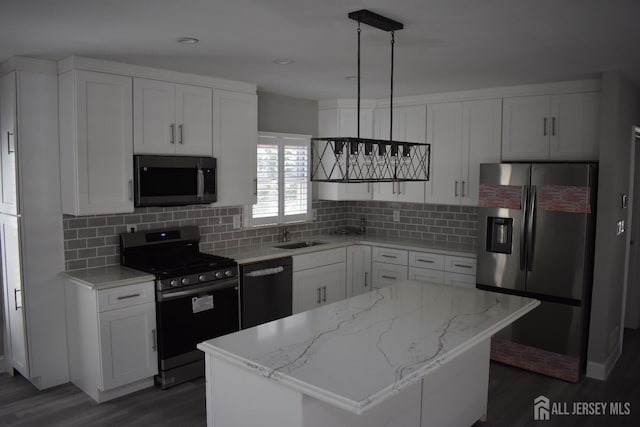 12 Juniper St, Metuchen, NJ 08840 - kitchen with range with gas stovetop, stainless steel fridge with ice dispenser, dishwasher, dark wood-type flooring, and white cabinetry
