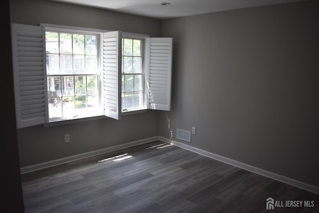 12 Juniper St, Metuchen, NJ 08840 - empty room with dark wood-type flooring and baseboards