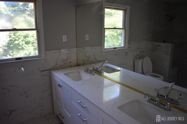 12 Juniper St, Metuchen, NJ 08840 - full bath with tile walls, toilet, wainscoting, double vanity, and marble finish flooring