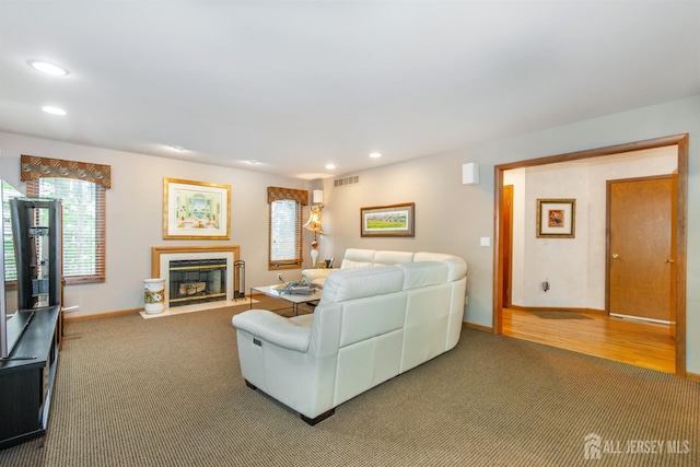 13 Clinton Ave, Edison, NJ 08820 - carpeted living room with baseboards, a fireplace with flush hearth, and recessed lighting