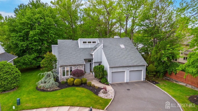 13 Clinton Ave, Edison, NJ 08820 - mid-century inspired home with a shingled roof, driveway, a garage, a chimney, and stone siding