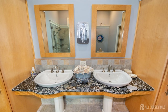 13 Clinton Ave, Edison, NJ 08820 - bathroom with a stall shower, double sink, and backsplash