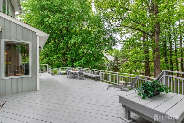 13 Clinton Ave, Edison, NJ 08820 - deck featuring outdoor dining space and view of wooded area