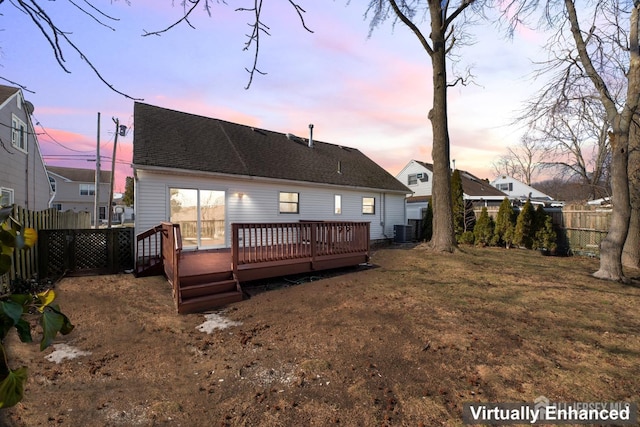 rear view of property featuring cooling unit, roof with shingles, fence, and a deck