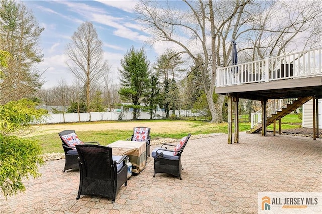 view of patio / terrace featuring stairway and a wooden deck
