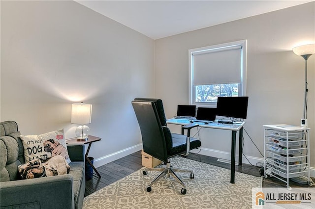 office area with wood finished floors and baseboards