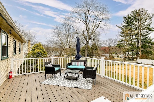 wooden terrace featuring an outdoor living space