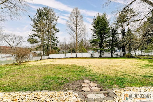 view of yard with fence