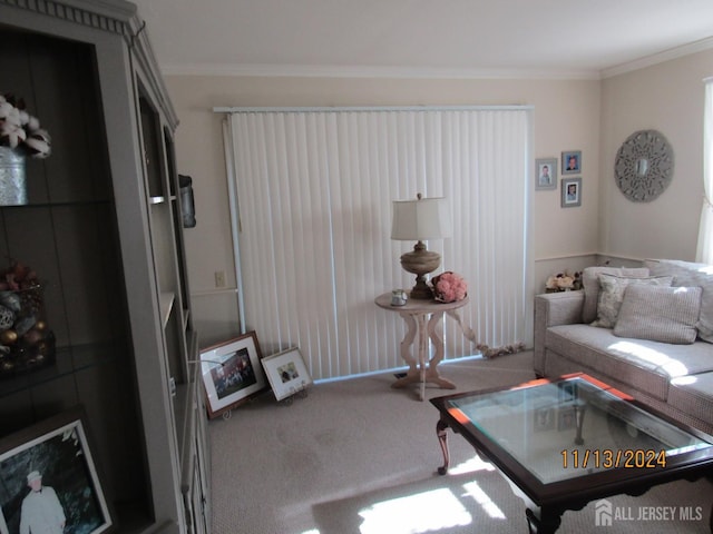 carpeted living room featuring ornamental molding