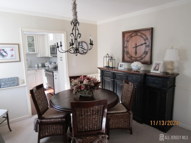 dining area with baseboards, carpet floors, an inviting chandelier, and crown molding