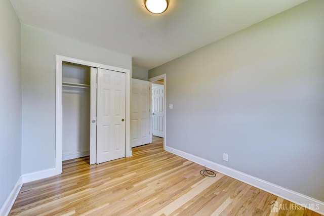 21 Princeton Rd, Old Bridge, NJ 08859 - unfurnished bedroom with light wood-style flooring and a closet