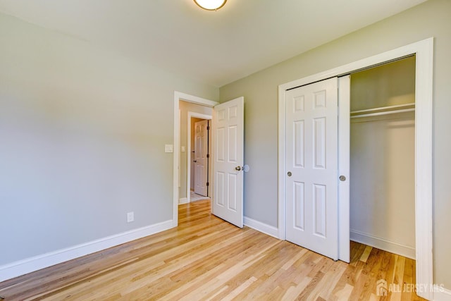 21 Princeton Rd, Old Bridge, NJ 08859 - unfurnished bedroom featuring light wood finished floors and a closet