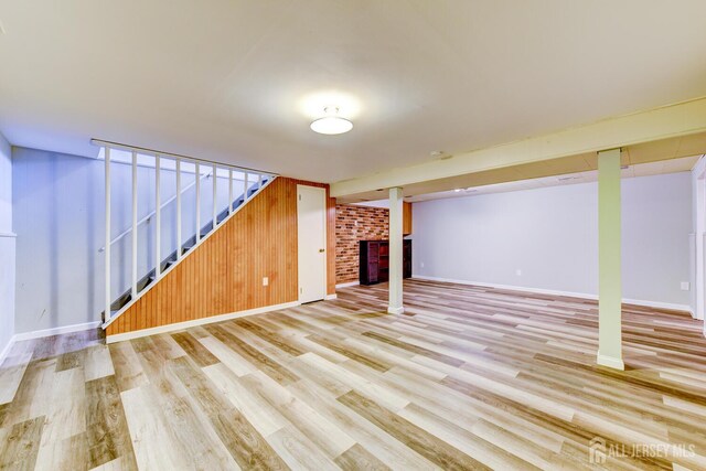 21 Princeton Rd, Old Bridge, NJ 08859 - finished basement featuring a fireplace, light wood-style flooring, stairs, and wood walls