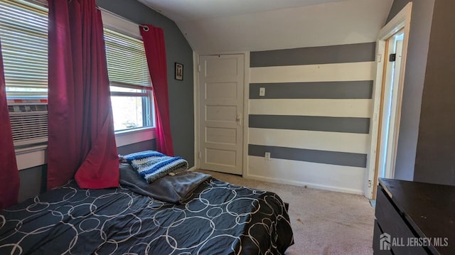 carpeted bedroom featuring vaulted ceiling