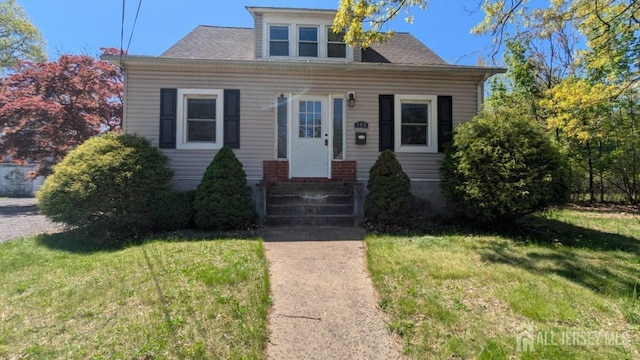 view of front facade featuring a front yard and entry steps