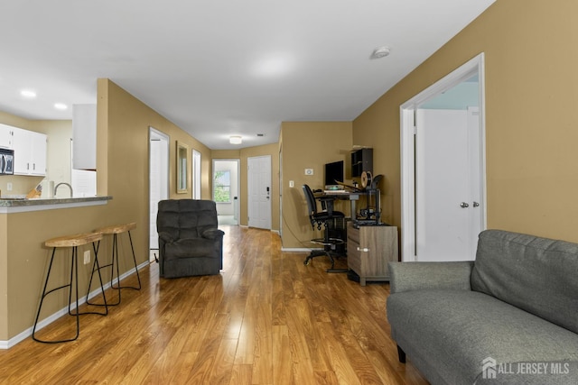 6072 Cedar Ct, South Brunswick, NJ 08852 - office area with light wood-style floors and baseboards