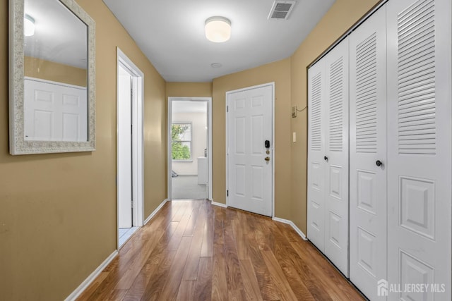 6072 Cedar Ct, South Brunswick, NJ 08852 - foyer entrance with wood finished floors and baseboards