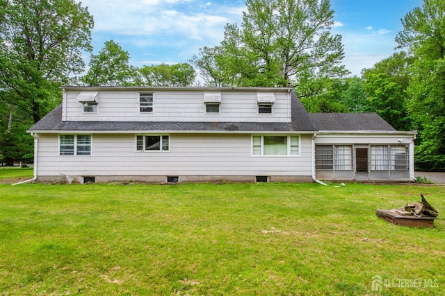 108 Midwood Way, Colonia, NJ 07067 - back of house with a lawn, a fire pit, and a shingled roof