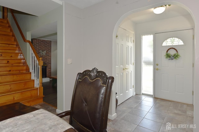100 Woodland Ave, Fords, NJ 08863 - entryway featuring arched walkways, stairs, and light tile patterned flooring