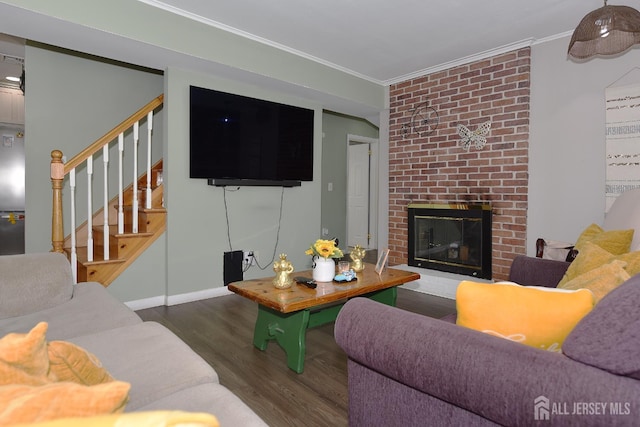 100 Woodland Ave, Fords, NJ 08863 - living area featuring wood finished floors, crown molding, a brick fireplace, and stairway