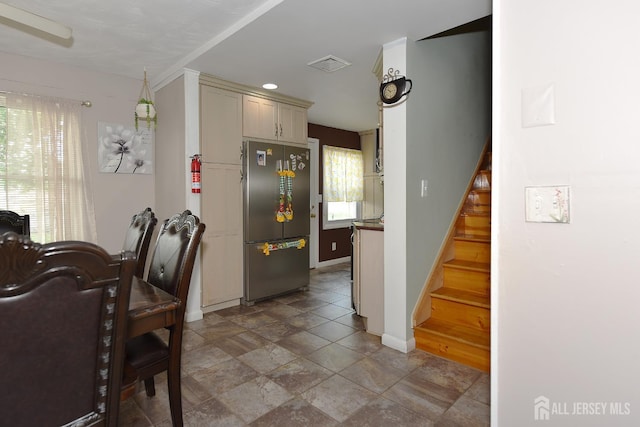 100 Woodland Ave, Fords, NJ 08863 - kitchen featuring freestanding refrigerator, light stone finish floors, and cream cabinets