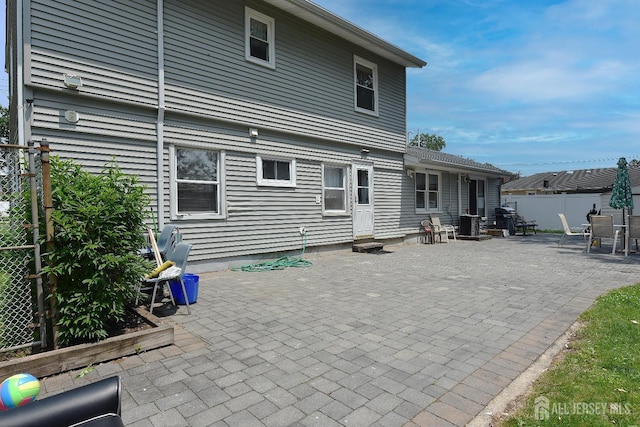 100 Woodland Ave, Fords, NJ 08863 - back of house featuring a fenced backyard and a patio