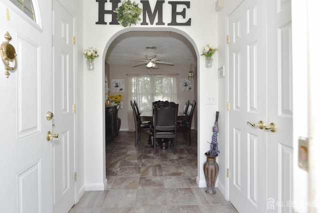 100 Woodland Ave, Fords, NJ 08863 - foyer entrance with arched walkways, stone finish flooring, and ceiling fan