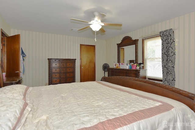 100 Woodland Ave, Fords, NJ 08863 - bedroom with wallpapered walls and ceiling fan