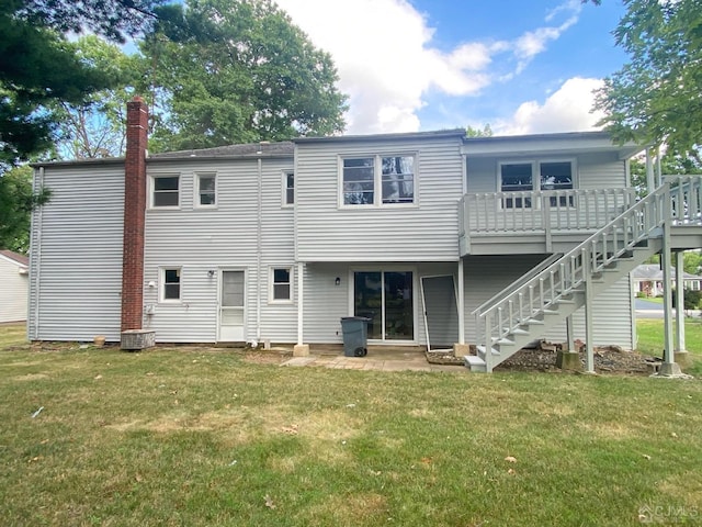 rear view of house with a lawn