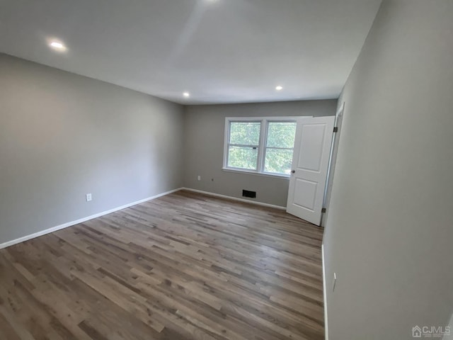 unfurnished room featuring light hardwood / wood-style flooring