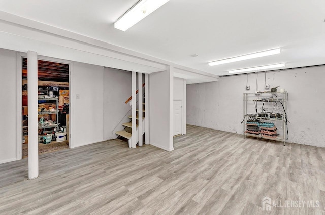 114 Jeffery Rd, Colonia, NJ 07067 - finished basement featuring wood finished floors and stairway