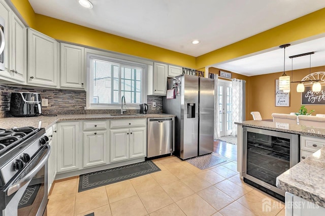 114 Jeffery Rd, Colonia, NJ 07067 - kitchen featuring appliances with stainless steel finishes, wine cooler, a sink, plenty of natural light, and recessed lighting