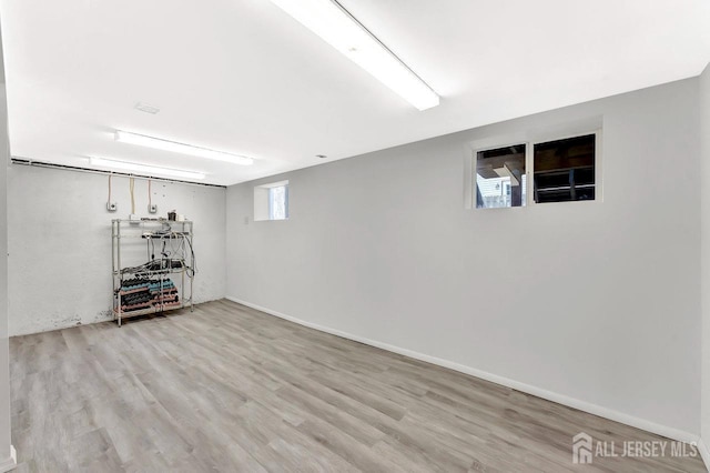 114 Jeffery Rd, Colonia, NJ 07067 - below grade area with light wood-type flooring and baseboards