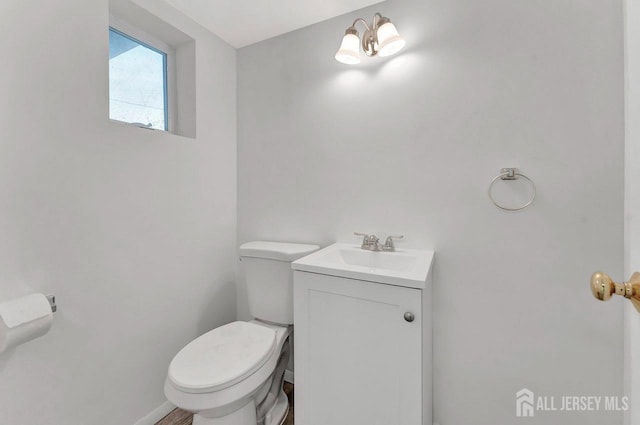 114 Jeffery Rd, Colonia, NJ 07067 - half bathroom with toilet, vanity, and baseboards