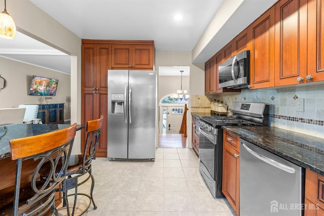 17 4th St, South River, NJ 08882 - kitchen featuring stainless steel appliances, tasteful backsplash, a chandelier, light tile patterned floors, and recessed lighting
