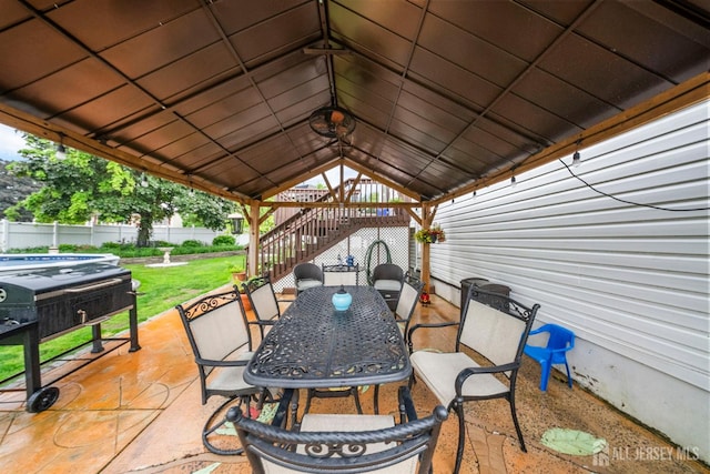 17 4th St, South River, NJ 08882 - view of patio with a hot tub, outdoor dining area, a gazebo, and stairs